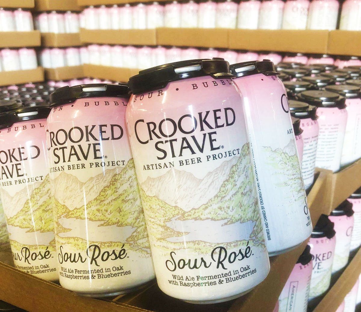 Cans of Crooked Stave Artisna Beer Project's Sour Rosé - Wild Ale Fermented in Oak with Rasberries & Blueberries