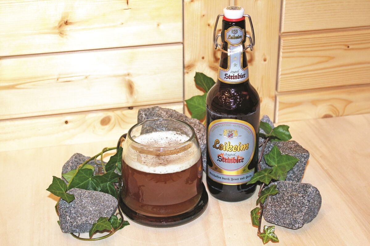 leikeim steinbier bottle and glassware with ivy and rocks