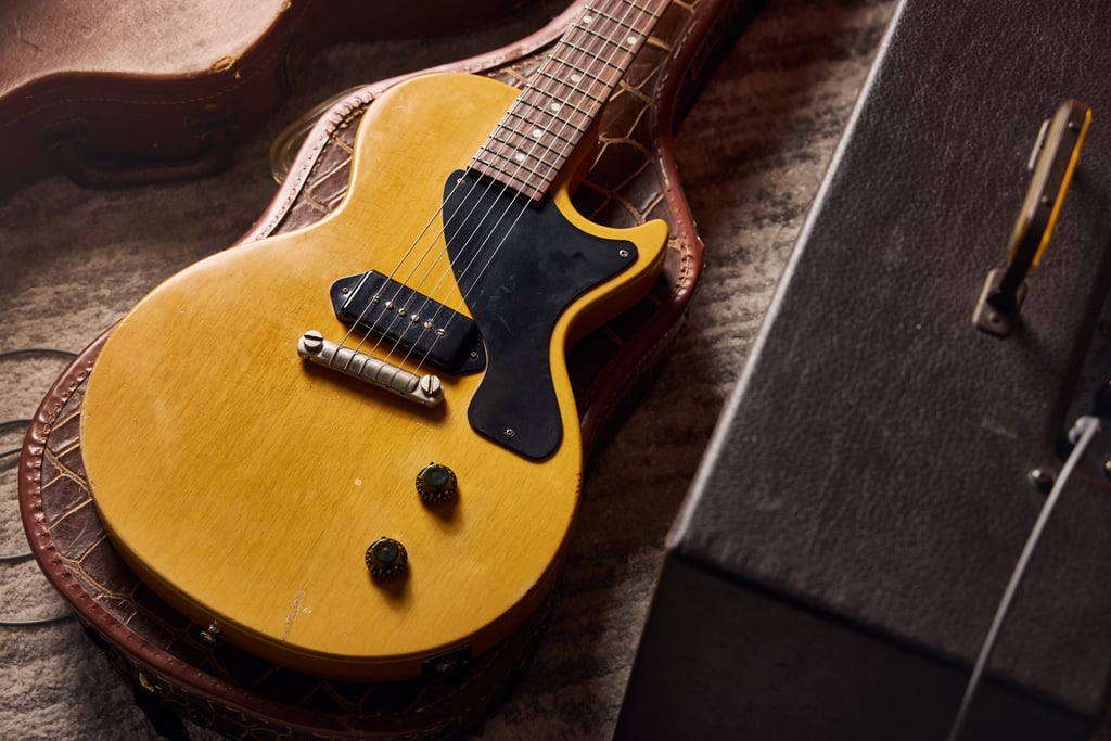 1958 GIBSON LES PAUL TV JUNIOR on top of alligator hardshell case