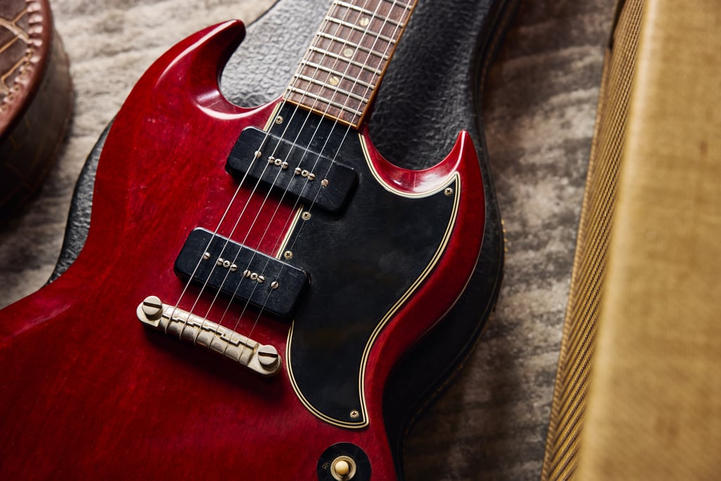 1964 GIBSON SG SPECIAL atop hardshell case