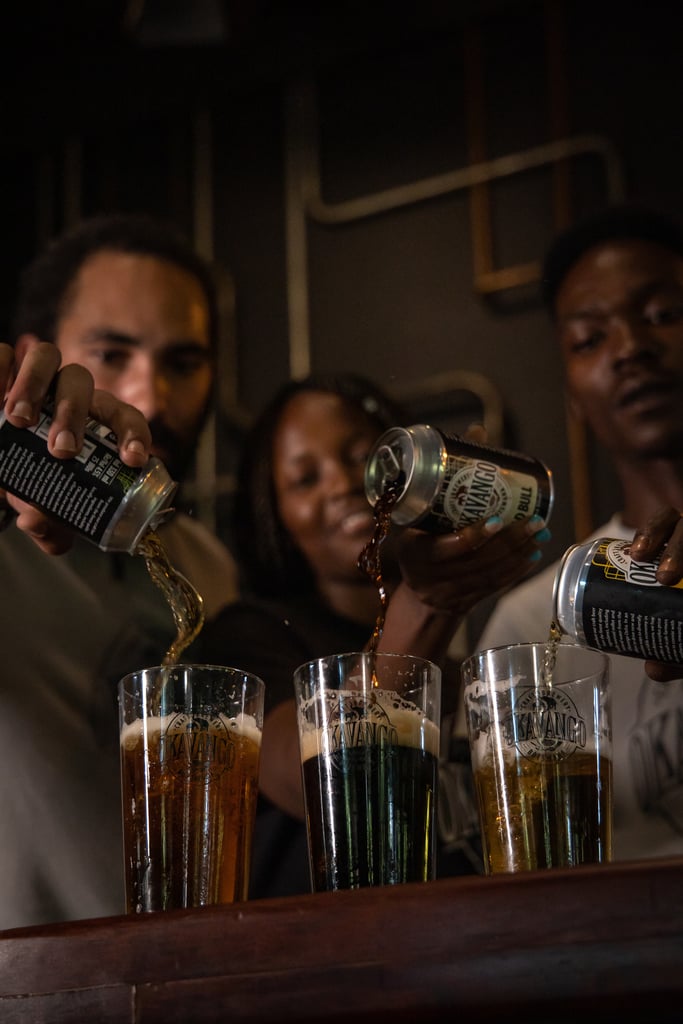 Okavango craft brewery patrons pour three distinct beers