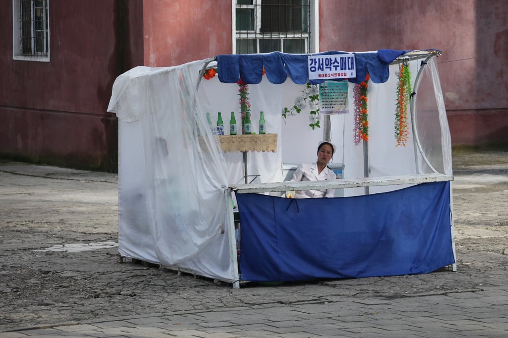 A Woman Selling Alcohol in a Pyongyang Beer Stall