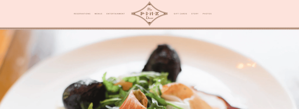 The title page of the webpage at The Pink Door is above a plated dish image.