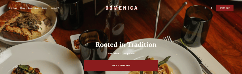 Italian cuisine on a wooden table with the title Rooted in Tradition and the Book a Table button that occupies the position of hero in the Domenica restaurant web page.