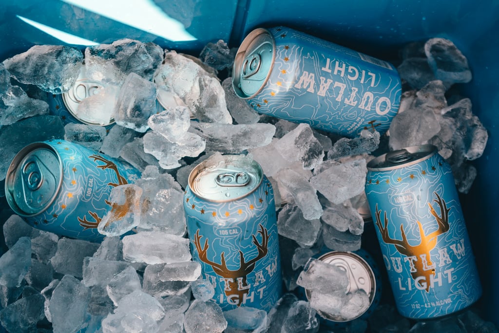 Cooler full of cans of Outlaw Light beer