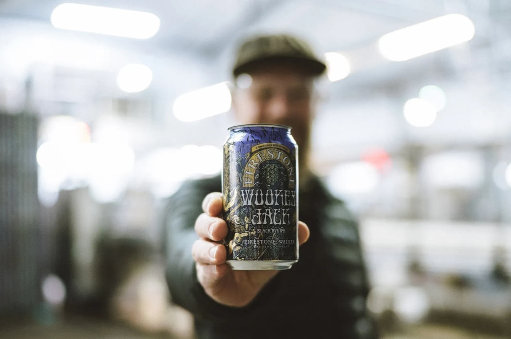 Person holding a fresh can of Wookey Jack.