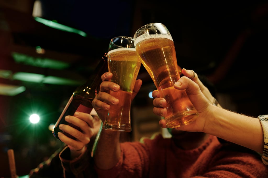 Several glass of beer being toasted